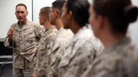 Col. Ernest L. Ackiss speaks to Marines on Cherry Point July 10 who recently earned Certified Logistics Associate and Certified Logistics Technician certificates.
