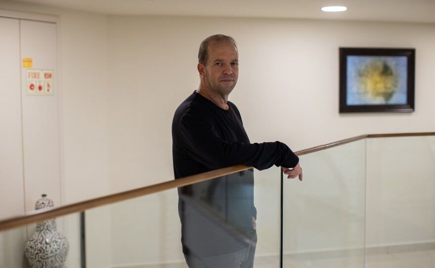 Erez Bergman, who was evacuated from Snir, his kibbutz in northern Israel located a few kilometers from the border with Lebanon, stands for a portrait at the Ramada Hotel where he is living temporarily on Nov. 28.