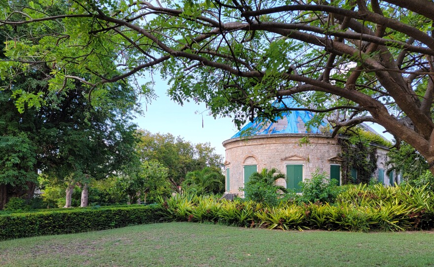 Tarps cover hurricane damage on the roof of the Estate Whim Great House.