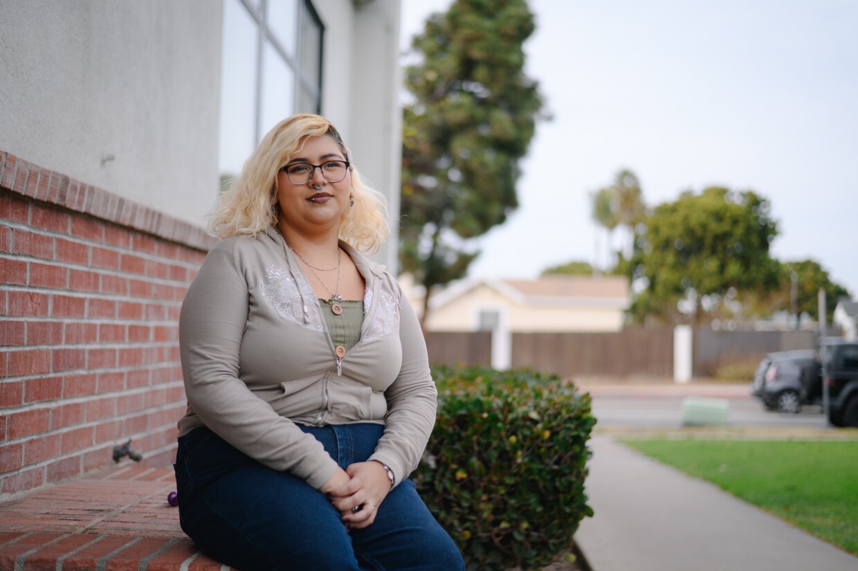 Chula Vista High technical theater student Aaleyah Madrigal stands for a portrait outside the high school in Chula Vista, California on Dec. 11, 2024. The school district is proposing schedule cuts that many Chula Vista High students worry will hurt the school’s renowned arts program.