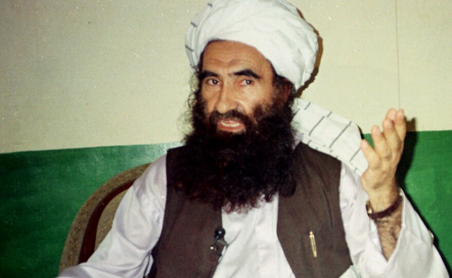 In this 1998 file photo, Jalaluddin Haqqani, founder of the militant group the Haqqani network, speaks during an interview in Pakistan. The Taliban say Haqqani, an ex-U.S. ally turned enemy, died Monday. He was 72.