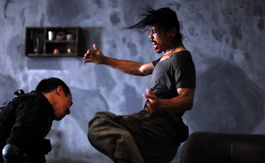 Joe Taslim as Jaka and Yayan Ruhian as Mad Dog in "The Raid."