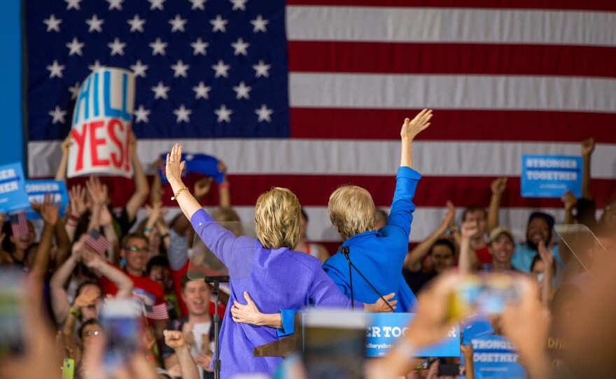 Sen. Elizabeth Warren (right) introduces Democratic presidential candidate Hillary Clinton at a rally at the Cincinnati Museum Center at Union Terminal on Monday.