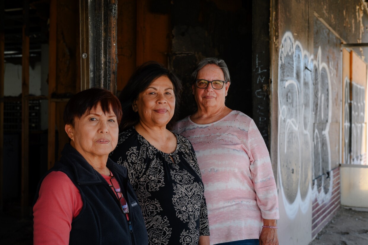 From left, longtime Niland residents Anna Garcia, Nellie Perez and Diana Juarez stand for a portrait in front of the old post office building in Niland in Imperial County on March 19, 2024. They lead the community advocacy group NorthEnd Alliance 111, which is fighting to bring the Niland Post Office back to the town.