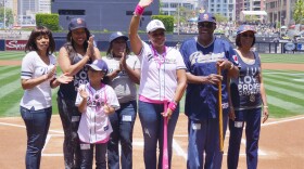 Lorraine Hutchinson, center, is shown with her family during a ceremony on May 11, 2014, at Petco Park to honor her as one of Major League Baseball's 31 honorary bat girls. The honor is announced on Mother's Day to promote breast cancer awareness.