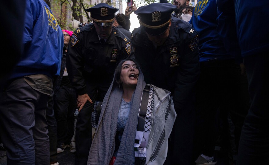 Police detain Nerdeen Kiswani, an organizer of pro-Palestinian demonstration group "Within Our Lifetime" during a protest on Friday, April 12, 2024, in New York.