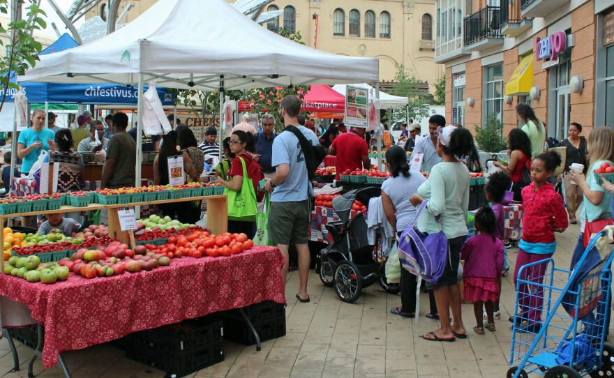 At a farmers market in Washington, D.C., recipients of federal food assistance like the WIC program can use vouchers to buy fresh fruits and vegetables.