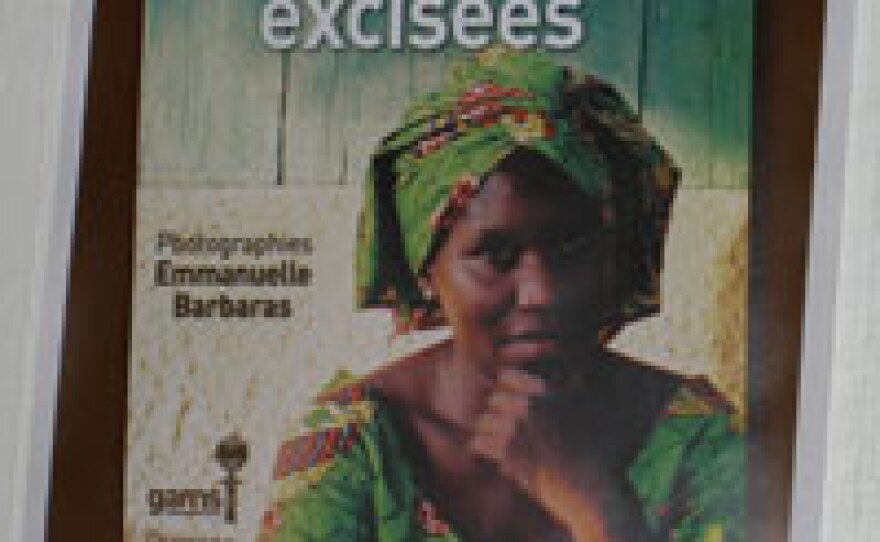 A poster on the wall of GAMS shows an African woman and the words "Our daughters will not be cut."
