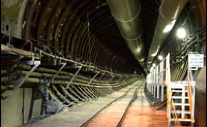 A rail tunnel descends into Yucca Mountain. If all licenses are granted, the facility will eventually become the largest repository of nuclear waste in the world.