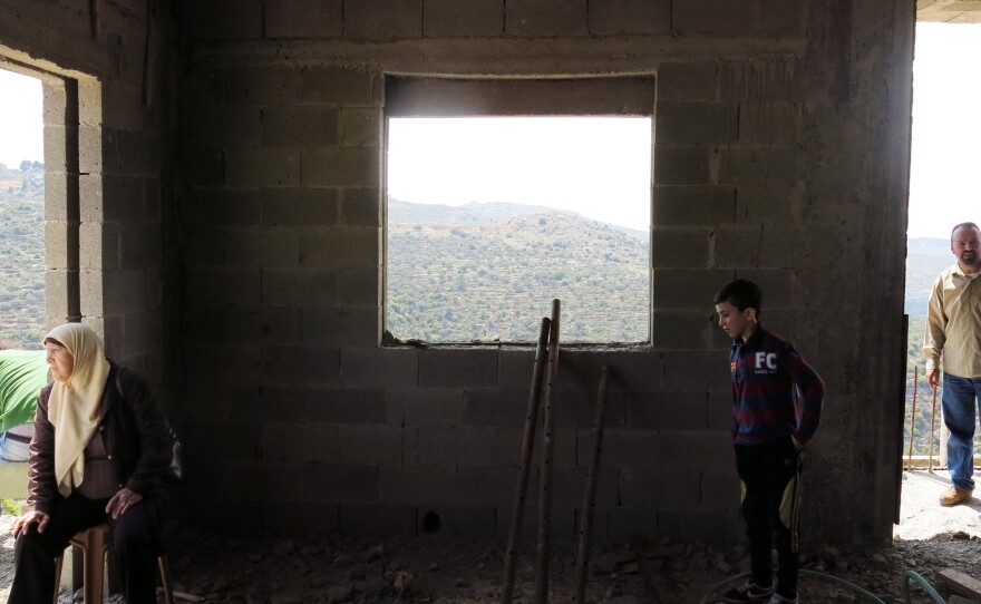 Members of the extended Dissi family check out the concrete shell and the view.