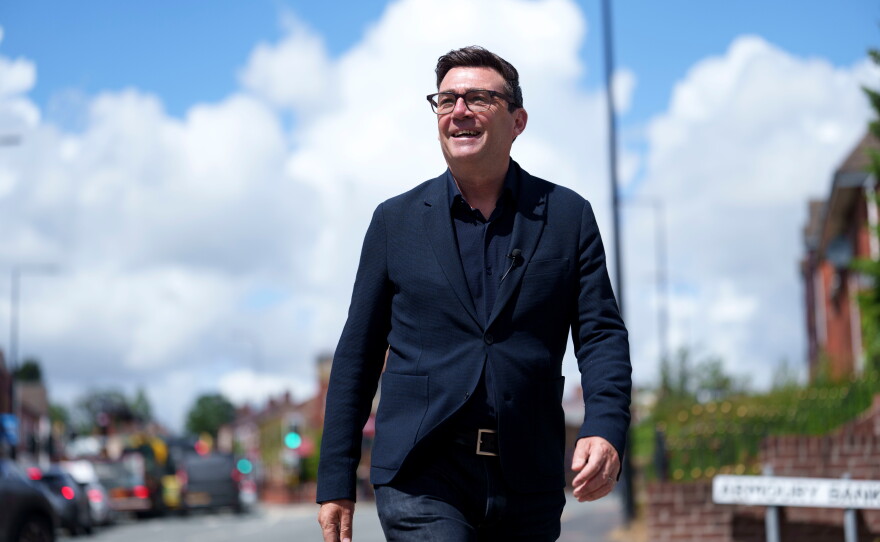 Andy Burnham smiles during a campaign visit to Ashton-in-Makerfield before a by-election, in Manchester, England, on June 9. Burnham is expected to succeed Keir Starmer as the U.K.'s Labour Party leader and prime minister.
