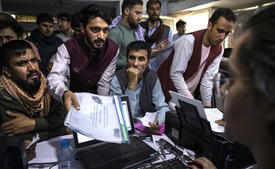Afghan Special Immigrant Visa applicants crowd into the Herat Kabul Internet cafe, seeking help applying for the SIV program on Aug. 8, 2021, in Kabul, Afghanistan. The Taliban took over Afghanistan a week later. More than 74,000 applicants remain in the backlog of the SIV program, designed to help those who served the U.S. overseas.