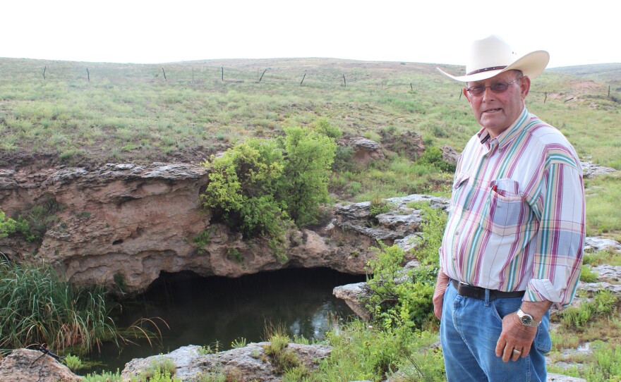 Nate Pike fears wells, like this one that supplies his ranch with water, will dry up completely after years of water pumping and irrigation in Kansas.