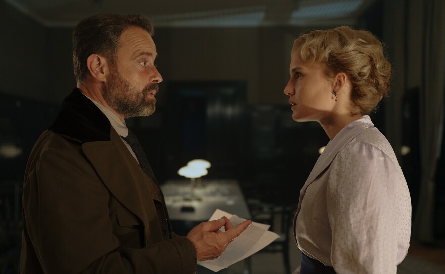 Oskar (Juergen Maurer) and Clara (Luise von Finckh) make a discovery in a press baron’s office. VIENNA BLOOD Season 4
