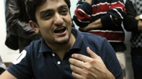 Wael Ghonim talking with reporters on Feb. 8, 2011, in Cairo's Tahrir Square as protests there continued. 