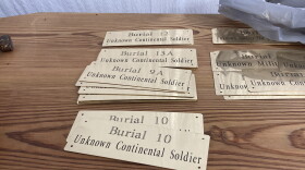 Plaques to help identify 14 unknown soldiers who were found at the site of the Battle of Camden and are being reburied are seen on Thursday, March 30, 2023, in Columbia, South Carolina. DNA analysis has recently identified one of them.