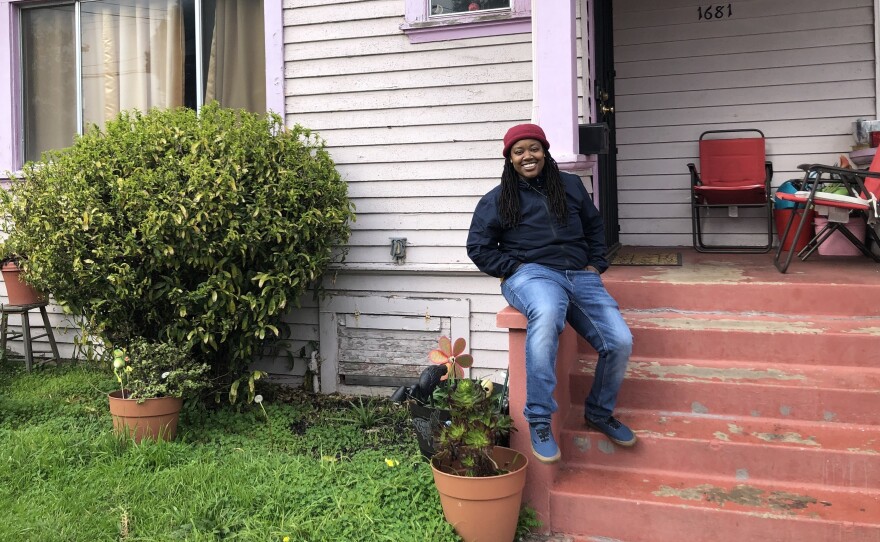Marquita Price outside her grandmother's house in East Oakland. She worries that contaminated rising groundwater threatens the health of her family and their assets.