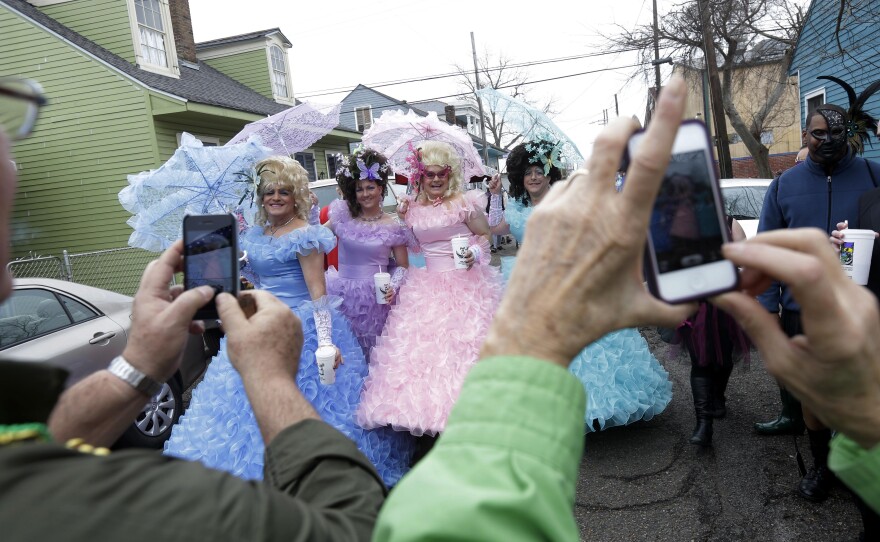 Tuesday: Revelers gather before the start of the Society of Saint Anne parade.