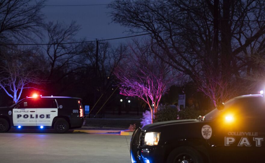 Police cars remain parked at Good Shepherd Catholic Community church on Saturday in Colleyville, Texas. Authorities said all hostages were freed safely.