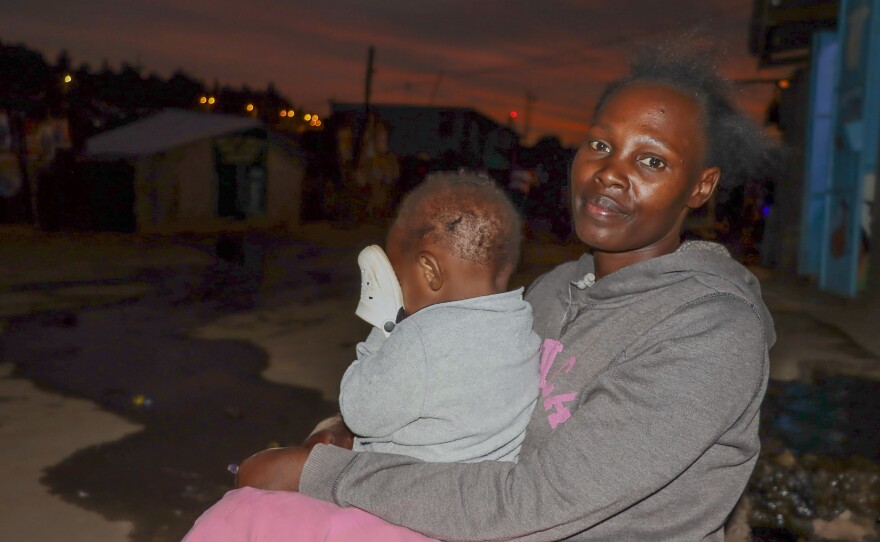 Phillistus Indosh works as an outdoor food vendor, keeps her baby by her side and breastfeeds when necessary. She says her customers understand. She's not a fan of baby bottles because of the need for sterilization.