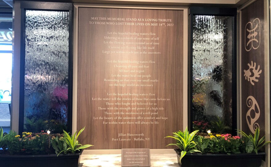 A water wall inside the newly reopened Tops grocery store pays tribute to the shooting victims with a poem by Buffalo's poet laureate, Jillian Hanesworth.