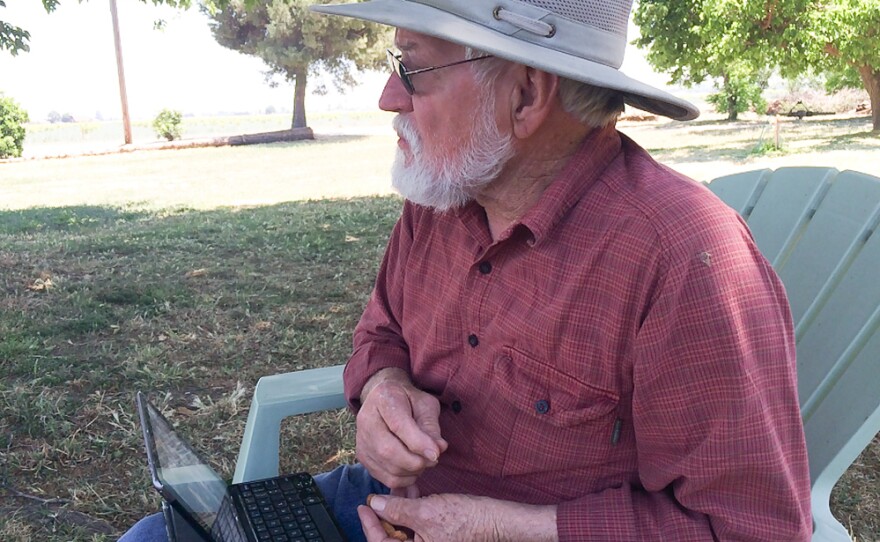 Glenn Anderson snacks on almonds at his farm in Hilmar, Calif. He's not a fan of pasteurizing the nuts — he says it ruins the taste, so that it "leans towards cardboard, as opposed to fresh almonds."