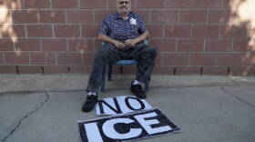 Jack Gerrittson sits with one of his "No ICE" signs in his driveway in Los Angeles in this undated photo. 
