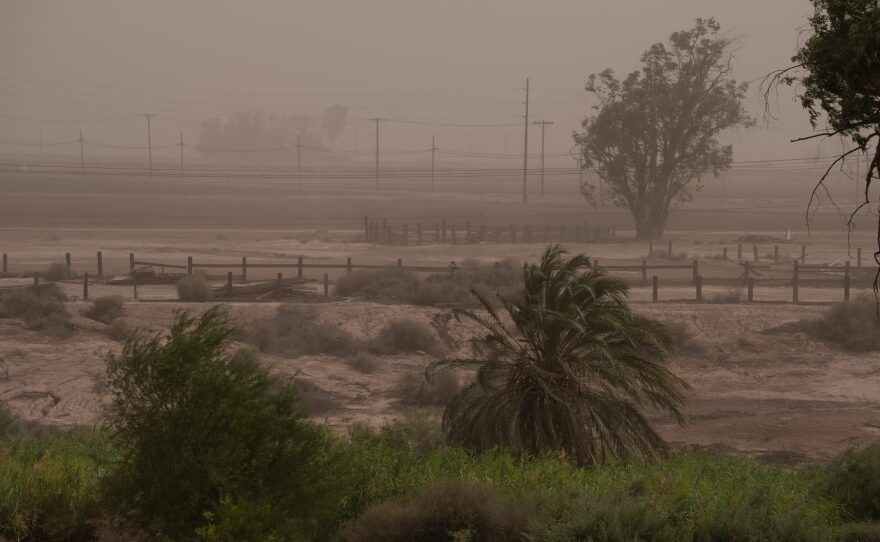 A dust storm absorbs farmland in Holtville, Calif. on Aug. 6, 2024.