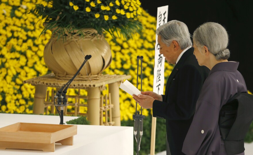 Japan's Emperor Akihito delivers his remarks with Empress Michiko during a memorial service at Nippon Budokan martial arts hall in Tokyo, on Saturday. His expression of "deep remorse" for Japan's wartime past is seen as an unprecedented apology.