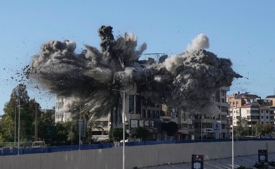 Smoke rises after an Israeli airstrike hits a building near the airport road in Beirut, Lebanon, Tuesday.