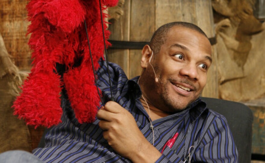 Elmo and Clash, on the <em>Sesame Street</em> set in 2006.