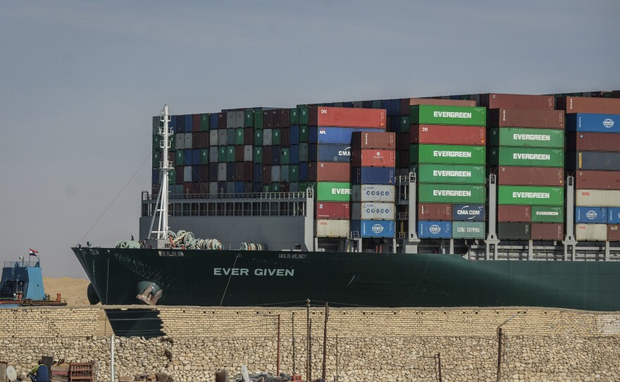 The "Ever Given" container ship, operated by the Evergreen Marine Corporation, sails through the Suez Canal after it was fully freed and floated on Friday.
