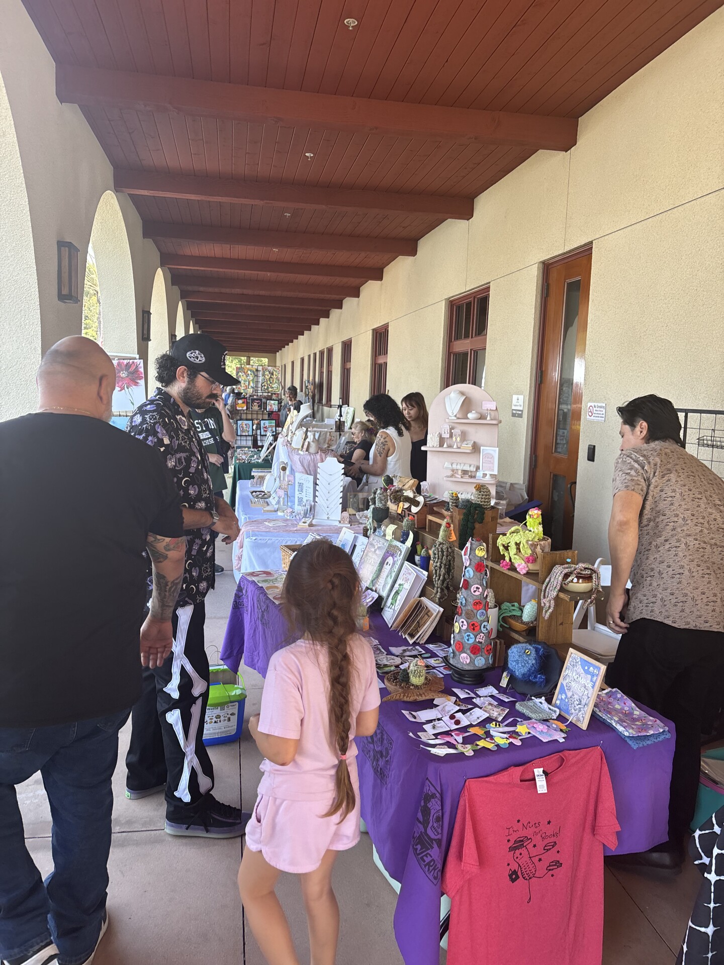 Visitors explore different vendor stands outside of Chula Vista City Hall during the inaugural art fest on Sept. 27, 2025.