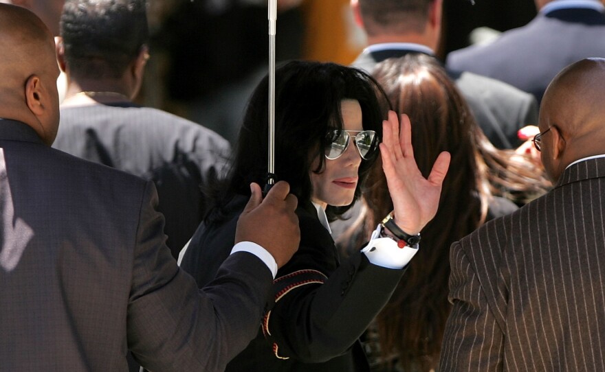 Michael Jackson in 2005, on his way into the Santa Barbara County Courthouse to hear the verdict in a 10-count case of child molestation brought against him. He was acquitted on all counts. In 2019, allegations of child sexual assault were once again raised against Jackson, who died in 2009.
