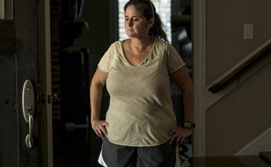 Jennifer McKnight was flooded out in New Orleans during Hurricane Katrina. Her Houston home was still filled with about 2 to 3 feet of water on Thursday.
