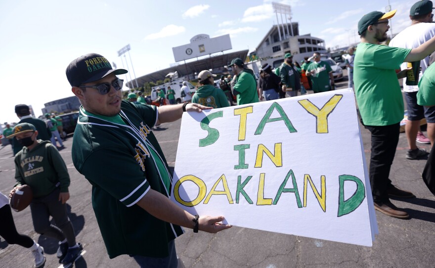 Reuben Ortiz of Modesto, Calif., holds a sign outside Oakland Coliseum to protest the Oakland Athletics' planned move to Las Vegas before the A's game with the Tampa Bay Rays on June 13, 2023. The Athletics' move to Las Vegas was unanimously approved Thursday, Nov. 16, 2023 by Major League Baseball team owners.