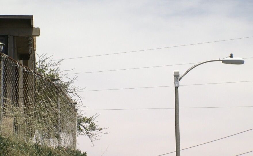 ShotSpotter listening device pictured atop light pole, June 17, 2019.