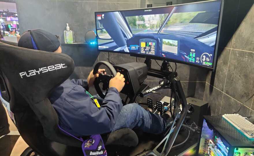A gamer tries out Logitech's new simulation driving chair at TwitchCon, Oct. 9, 2022.<br/><br/>