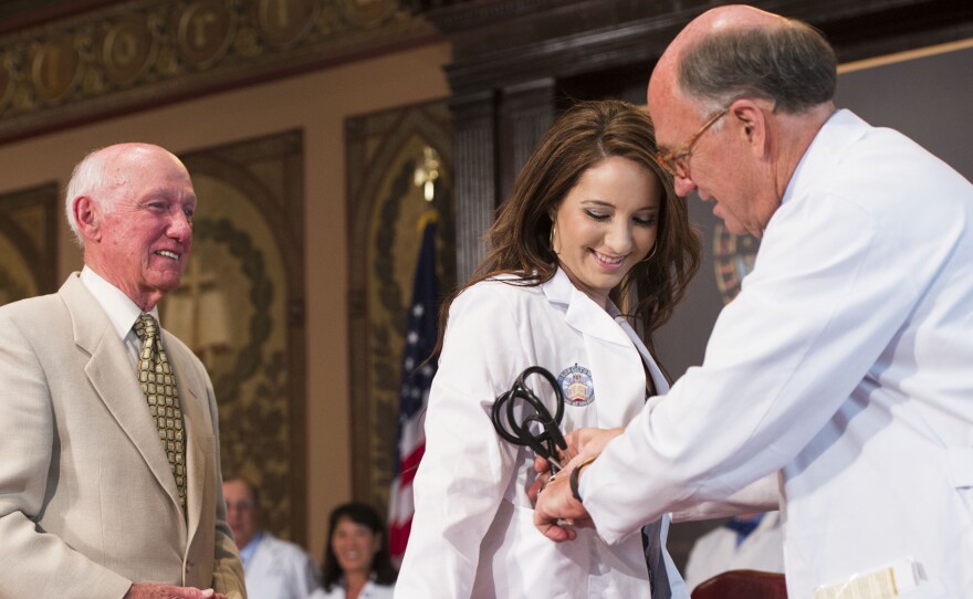 Victoria Elizabeth Fischer was presented with a white coat by her grandfather, Dr. Christian Van Den Heuvel, at Georgetown University School of Medicine in August. The ceremony marks the start for each new class of medical students.