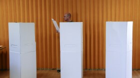 A man casts his ballot during elections in San Diego, Nov. 4, 2014.