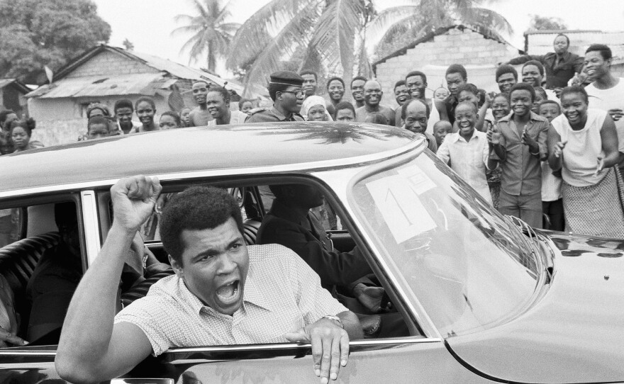 Ali tours downtown Kinshasa on Sept. 17, 1974, ahead of his fight with Foreman. The bout was famously hyped as the "Rumble in the Jungle."