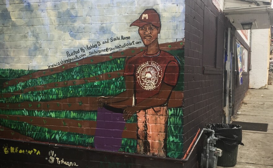 Kids in the Ashview Heights community painted a mural on the side of the Fair Street Superette, the corner store near the site for Marddy's shared kitchen and marketplace.