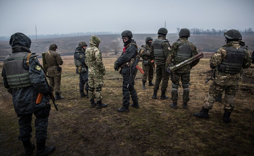 Ukrainian troops train with small arms on March 13, 2015, outside Mariupol, Ukraine. The Minsk ll ceasefire agreement, which has continued to hold despite being violated more than 1,000 times, nears the one-month mark.
