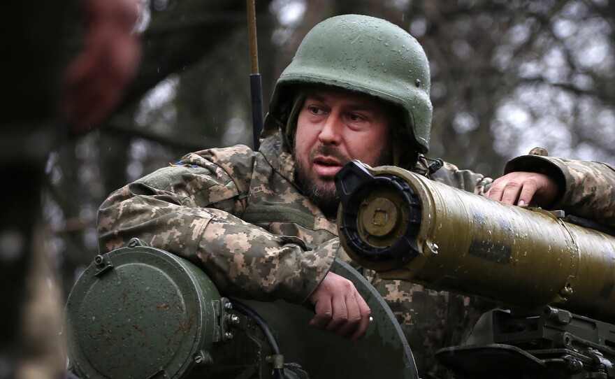 A Ukrainian soldier stands on an armored personnel carrier near the frontlines with Russian troops, in Izium, in eastern Ukraine on Monday.  Russia fared poorly when it invaded Ukraine eight weeks ago. Now Russia says it has now launched a new offensive focused on eastern Ukraine.