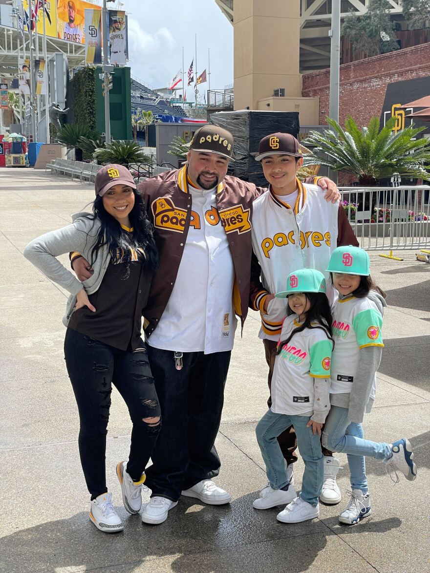 Adults and children in Padres merch on Opening Day. Petco Park, San Diego, Calif. March 30, 2023.