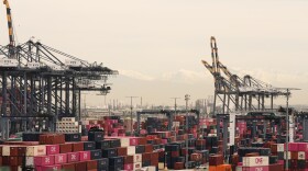 Containers are stacked at the Port of Los Angeles on Friday.