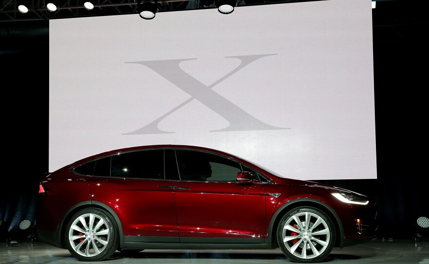 Tesla says the Model X can seat seven adults and go from zero to 60 miles per hour in 3.2 seconds.