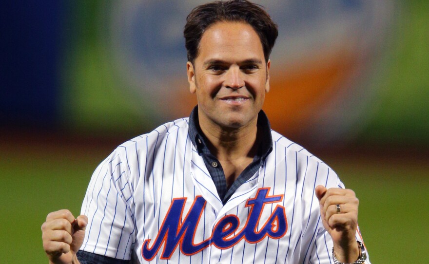 Former New York Met Mike Piazza celebrates last year after throwing out the first pitch in Game 3 of the World Series. He's been elected to the Baseball Hall of Fame.