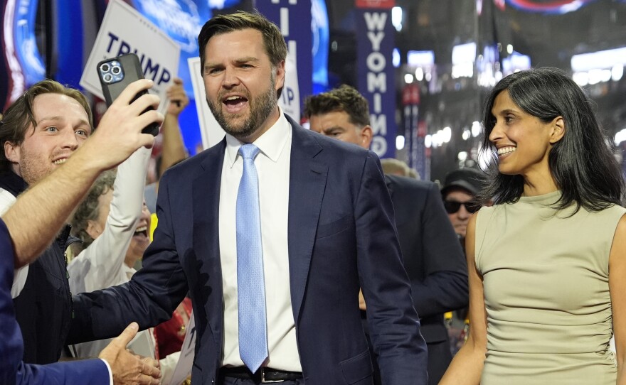 Republican vice presidential candidate Sen. JD Vance, R-Ohio, and his wife Usha Chilukuri Vance arrive on the floor during the first day of the 2024 Republican National Convention at the Fiserv Forum, Monday, July 15, 2024, in Milwaukee.