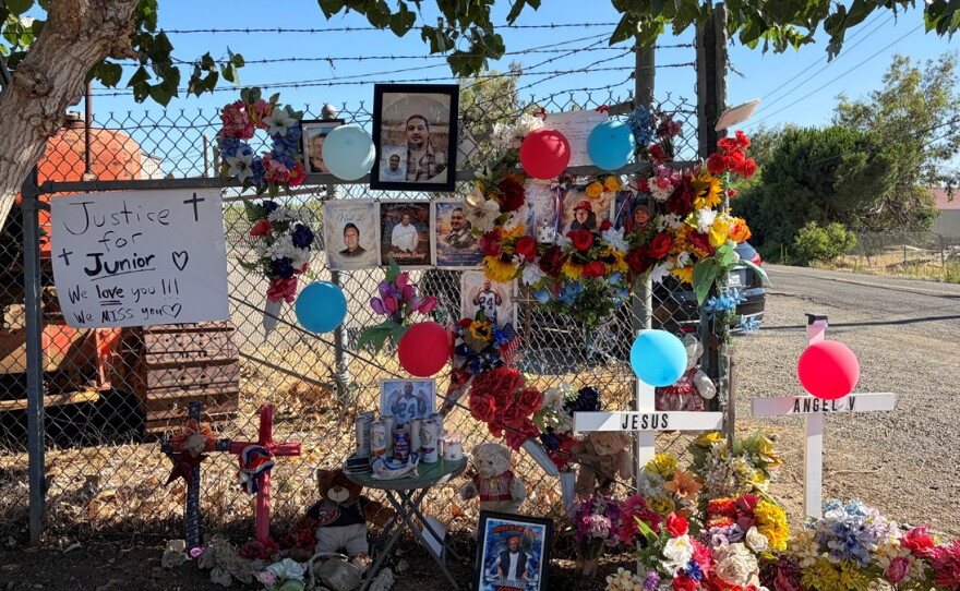 A makeshift memorial to the seven men killed in a fireworks warehouse explosion stands in the Dollar General lot on Wednesday, July 1, 2026, in Esparto, Calif. Friends and family members gathered nearby for a vigil marking one year since the blast.